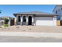 Charming single-Gathering home with a two-car garage and well-kept landscaping on a sunny day at 7802 E Quintana Ave, Mesa, AZ 85212