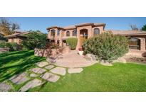 Brick house with landscaped yard and stone pathway at 8280 S Pecan Grove Cir, Tempe, AZ 85284