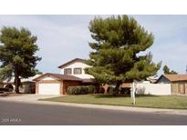 Two-story house with attached garage and mature landscaping at 11051 N 53Rd Ave, Glendale, AZ 85304