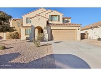 Two-story house with a large driveway and landscaping at 1132 W Santa Gertrudis Trl, San Tan Valley, AZ 85143