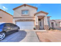 Two-story house with attached garage and landscaping at 1406 S Navajo Ln, Coolidge, AZ 85128