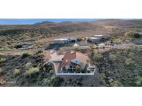 Aerial view of a single-story house with a red tile roof and mountain views at 16544 E Trevino Dr, Fountain Hills, AZ 85268