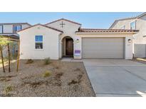 One-story home with a two-car garage and desert landscaping at 18067 W Camino De Oro --, Surprise, AZ 85387