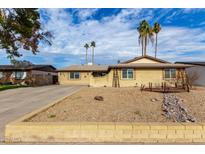 Single story home with landscaped front yard, driveway, and desert landscaping at 3808 W Mission Ln, Phoenix, AZ 85051