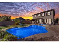 Stunning backyard oasis featuring a sparkling pool, spa, and expansive patio at 10307 E Nopal Ave, Mesa, AZ 85209