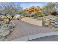 Luxury home with paver driveway, stunning architecture, and desert landscaping at 15418 N Castillo Dr, Fountain Hills, AZ 85268