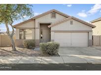 One-story house with neutral exterior, two-car garage, and landscaping at 16508 N 71St Ave, Peoria, AZ 85382