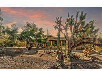 Spanish-style home with desert landscaping and stunning sunset views at 4979 E Calle De Los Arboles --, Cave Creek, AZ 85331