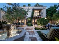 Elegant courtyard with fountain and patio furniture, adjacent to the home at 7500 E Mccormick Pkwy # 63, Scottsdale, AZ 85258