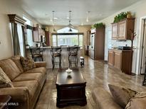 Spacious kitchen with island, stainless steel appliances, and ample cabinetry at 7750 E Broadway Rd # 175, Mesa, AZ 85208