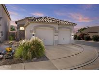 Two-car garage, desert landscaping, and a charming curb appeal at 8429 W Salter Dr, Peoria, AZ 85382