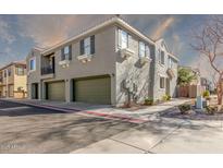 Exterior view of a two-story house with a three-car garage and landscaped yard at 1255 S Rialto -- # 114, Mesa, AZ 85209