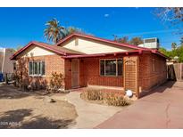 Brick home with a red roof, landscaped yard, and walkway at 2326 E Yale St, Phoenix, AZ 85006