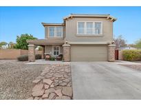 Two-story house with stone accents and a two-car garage at 2498 E Ivanhoe Ct, Gilbert, AZ 85295