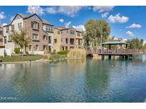 Community with lake, walking bridge and luxury homes at 2722 S Cavalier Dr # 102, Gilbert, AZ 85295