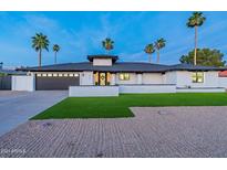 Stunning contemporary home with landscaped lawn and desert landscaping at 14241 N 54Th St, Scottsdale, AZ 85254