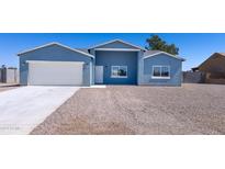 Newly built home with blue exterior, white garage door, and gravel driveway at 15245 S Country Club Dr, Arizona City, AZ 85123