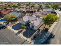 Single-story home with tile roof, desert landscaping, and a corner lot location at 15437 W Domingo Ln, Sun City West, AZ 85375