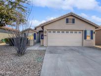 Single-story home with two-car garage and desert landscaping at 2635 E Desert Wind Dr, Casa Grande, AZ 85194