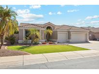 Single-story home with a two-car garage and nicely landscaped front yard at 3165 E Indigo Bay Dr, Gilbert, AZ 85234