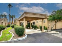 Covered carport with lush landscaping and nicely manicured bushes at 4015 N 78Th St # 141, Scottsdale, AZ 85251