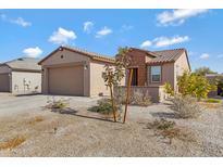 Single-story home with a two-car garage and desert landscaping at 5429 S 23Rd Dr, Phoenix, AZ 85041