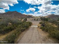 Aerial view of a sprawling desert property with a large house and private pool at 5713 W Sun Dance Dr, San Tan Valley, AZ 85144