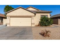 One-story house with a two-car garage and desert landscaping at 5810 W Puget Ave, Glendale, AZ 85302