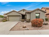 Single-story home with a two-car garage and desert landscaping at 7606 E Globemallow Ln, Gold Canyon, AZ 85118