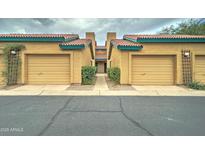 Tan stucco building with multiple garages and a walkway at 225 W 1St St # 118, Mesa, AZ 85201