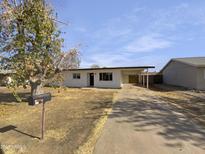 Updated single-story home with carport and spacious yard at 25 S Sahuaro Dr, Gilbert, AZ 85233