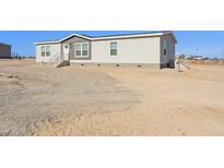 New construction single story home with gravel front yard at 2707 S 357Th Dr, Tonopah, AZ 85354
