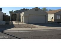 Single-story house with attached garage and front yard at 2845 W Angela N Dr, Phoenix, AZ 85053