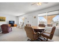 Bright living room with dining area, view, and comfy seating at 3270 S Goldfield Rd # 514, Apache Junction, AZ 85119