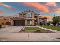 Two-story house with brown exterior, three-car garage, and landscaped yard at 339 E Horseshoe Ave, Gilbert, AZ 85296