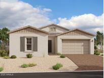 One-story home with beige exterior, brown roof, and brick driveway at 11435 E Utah Ave, Mesa, AZ 85212