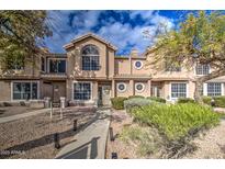 Two-story townhome with attractive landscaping and a walkway at 13842 S 40Th St # 1004, Phoenix, AZ 85044