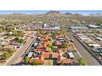 Aerial view of a community with multiple buildings, landscaping, and a pool at 17243 N 16Th St # 1, Phoenix, AZ 85022