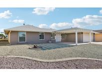 House exterior with a pergola and attached garage at 17635 N Buntline Dr, Sun City West, AZ 85375