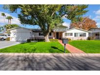 Charming single story home with a well-manicured lawn at 2130 E San Juan Ave, Phoenix, AZ 85016