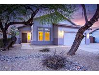 One-story house with a two-car garage and desert landscaping at 2304 S Abbey --, Mesa, AZ 85209