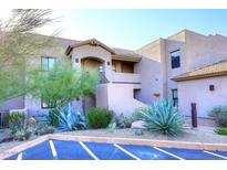 Attractive desert landscape enhances this condo's exterior elevation at 34457 N Legend Trail Pkwy # 2008, Scottsdale, AZ 85262