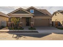 Craftsman style home with a two-car garage and landscaped front yard at 4267 E Bernice St, Gilbert, AZ 85295