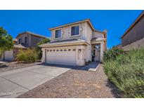 Two-story house with a two-car garage and landscaped front yard at 4711 E Silverwood Dr, Phoenix, AZ 85048