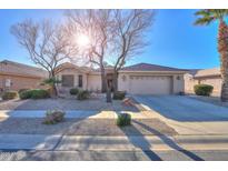 Single-story home with desert landscaping and two-car garage at 143 S Los Cielos Ln, Casa Grande, AZ 85194