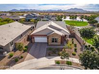 Aerial view of a house and neighborhood with mountain views at 19087 E Walnut Ct, Queen Creek, AZ 85142