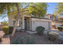 Two-story house with a two-car garage and landscaped front yard at 23735 W Wayland Dr, Buckeye, AZ 85326