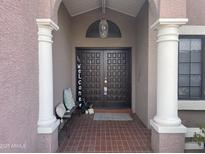 Inviting entryway with double doors and tiled porch at 3017 W Mercer Ln, Phoenix, AZ 85029