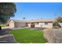 Single-story house with a well-maintained lawn and walkway at 4016 W Myrtle Ave, Phoenix, AZ 85051