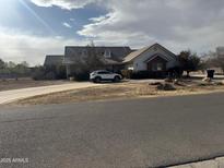 House exterior featuring a large yard and driveway at 4257 E Cathy Dr, Gilbert, AZ 85296